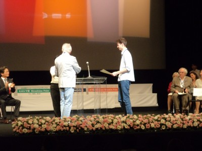 Tomek Ducki receiving his prize